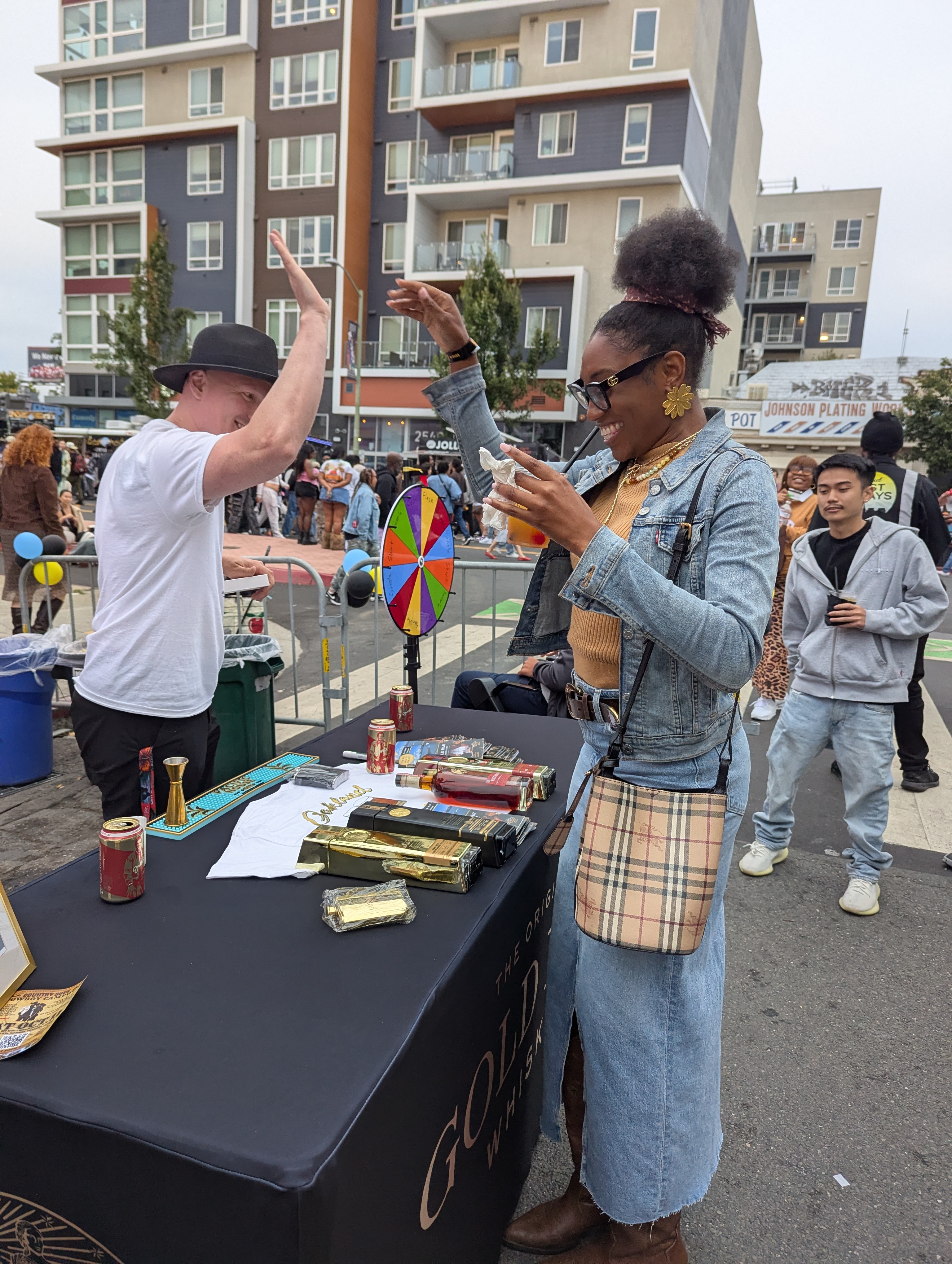 Weston and a guest exchange a high five at Oakland First Friday